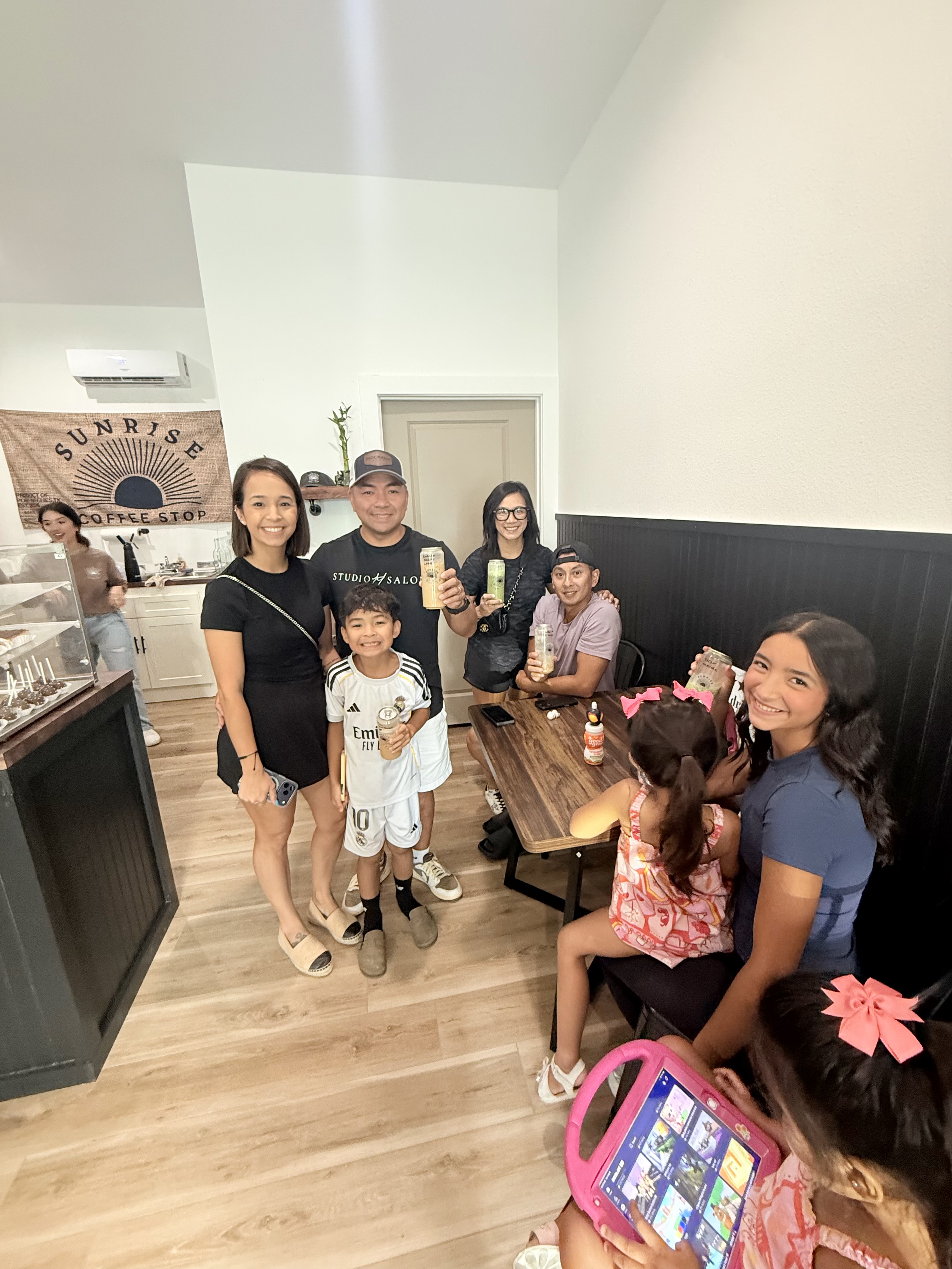Families and friends gathered with drinks at Sunrise Coffee Stop in Port Neches